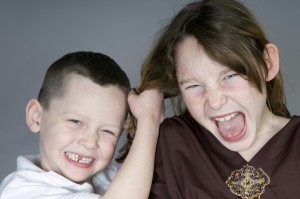 Young boy and girl in a fight